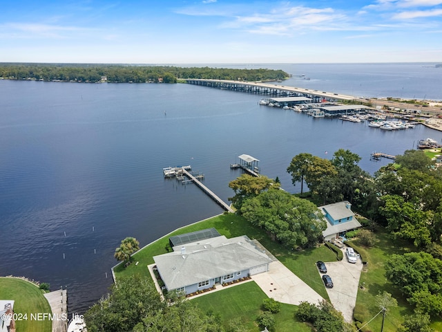 birds eye view of property with a water view