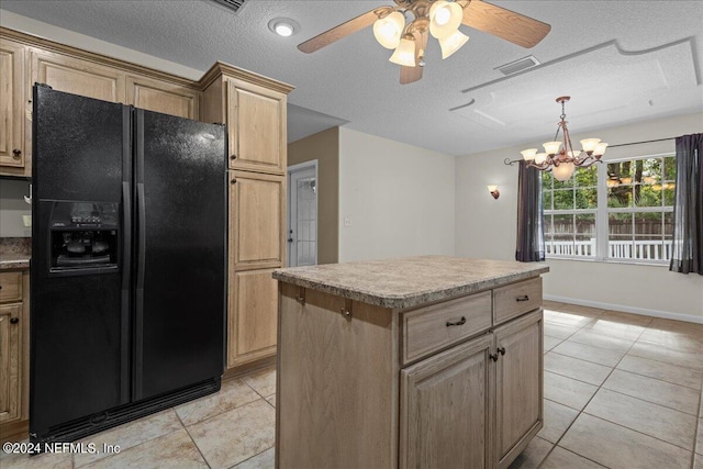 kitchen with light tile patterned floors, a textured ceiling, black refrigerator with ice dispenser, and a kitchen island