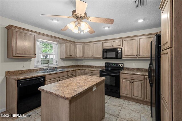 kitchen featuring a textured ceiling, ceiling fan, sink, black appliances, and a kitchen island