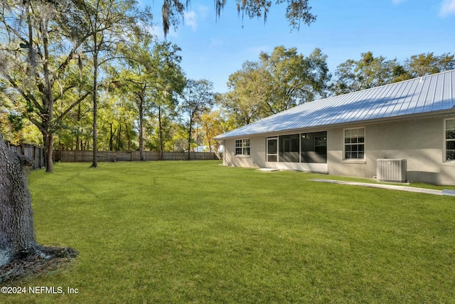 view of yard featuring central AC unit