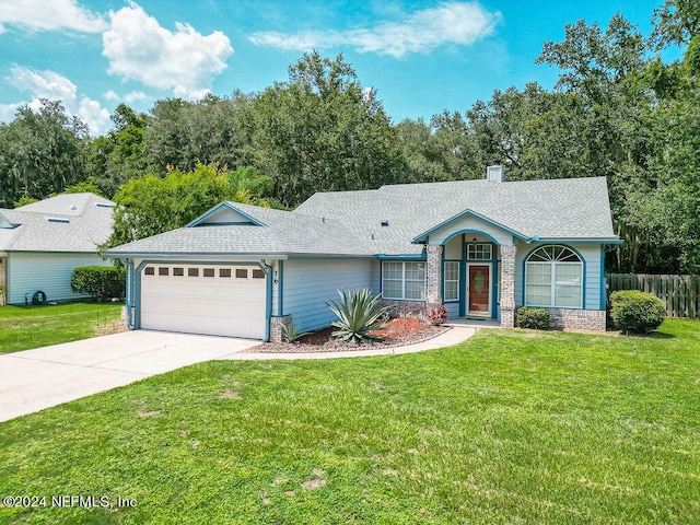 ranch-style house with a garage and a front yard