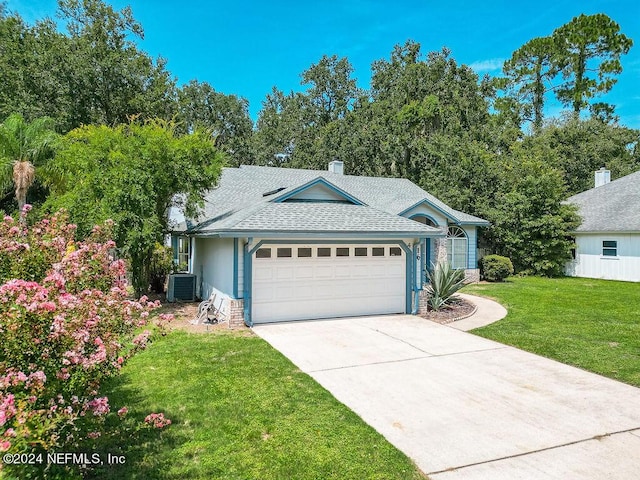 view of front of house with driveway, roof with shingles, an attached garage, a front lawn, and central AC