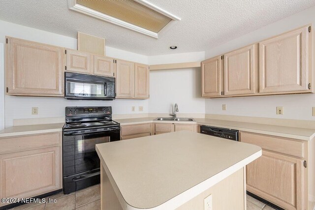 kitchen with light brown cabinetry, a kitchen island, sink, and black appliances