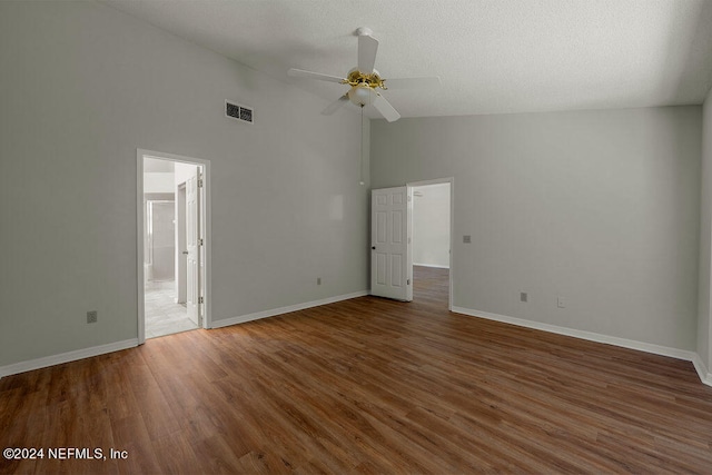 spare room with high vaulted ceiling, ceiling fan, and wood-type flooring