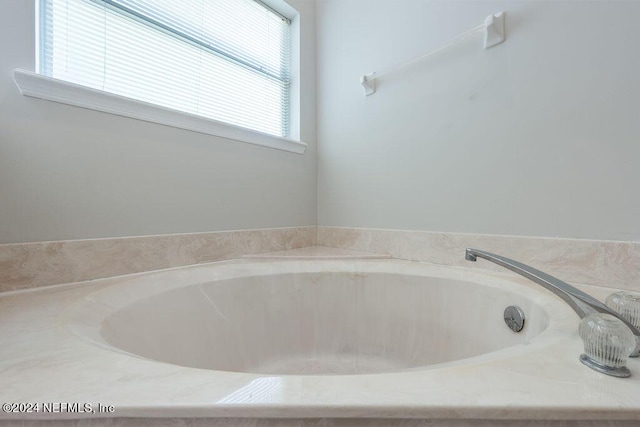 bathroom featuring a bath