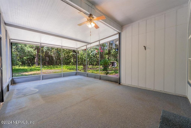 unfurnished sunroom with ceiling fan