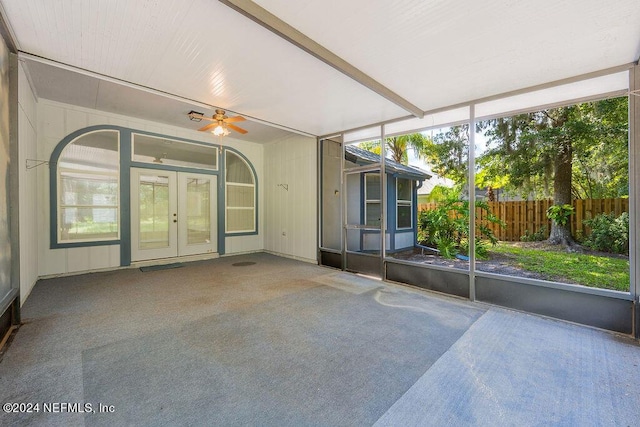 unfurnished sunroom with french doors and a ceiling fan