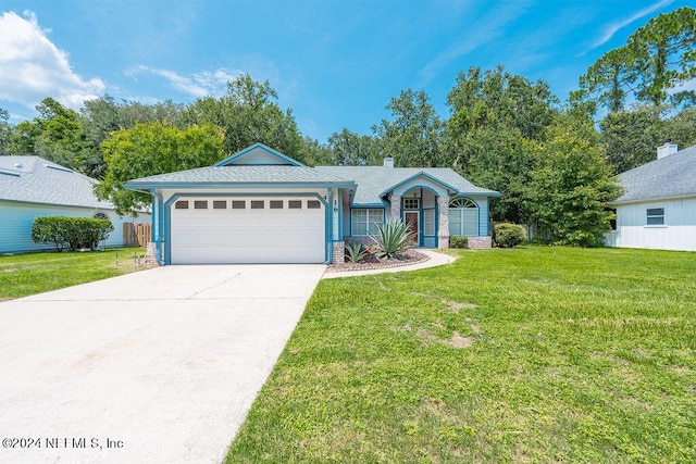 ranch-style house with an attached garage, driveway, and a front yard