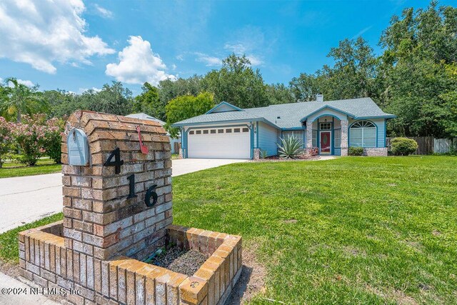 single story home featuring a garage, a front yard, driveway, and fence