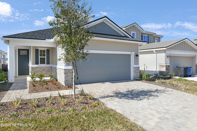 craftsman-style house featuring a garage and covered porch