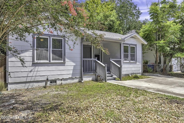 view of front of property with fence and a front yard