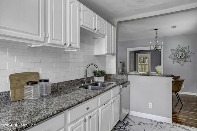 kitchen featuring dishwasher, dark stone countertops, marble finish floor, white cabinetry, and a sink