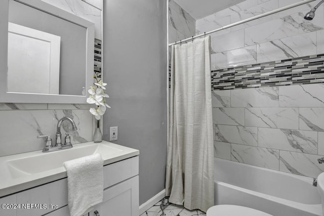 full bathroom with toilet, marble finish floor, shower / bathtub combination with curtain, vanity, and backsplash