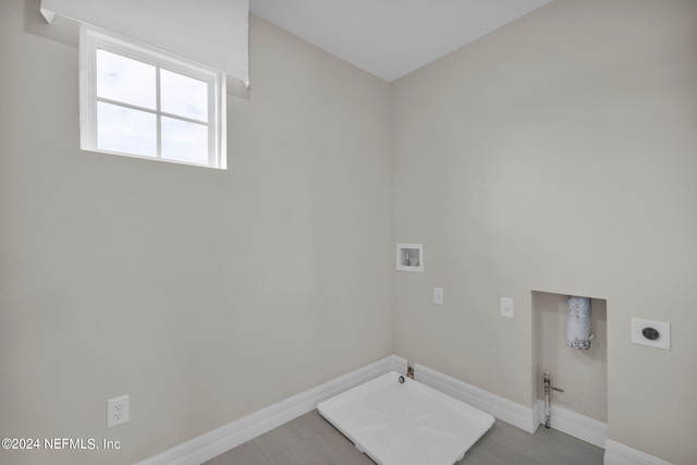 laundry area featuring washer hookup, hardwood / wood-style floors, gas dryer hookup, and hookup for an electric dryer