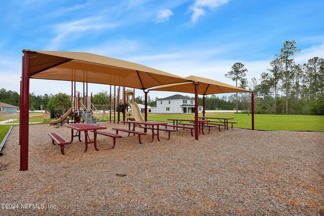 view of home's community with a yard and a playground