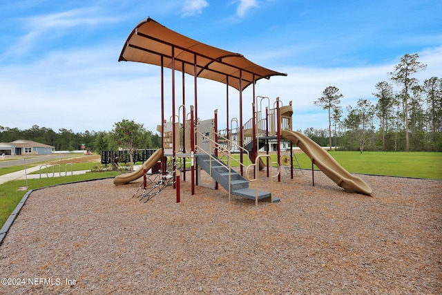 view of jungle gym featuring a lawn