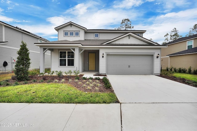 view of front facade featuring a garage and a front lawn