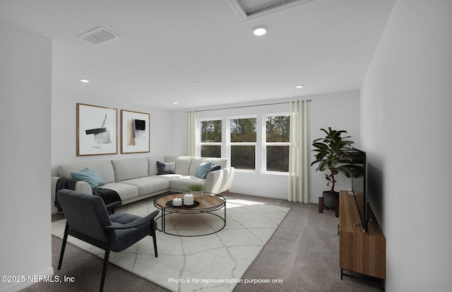 carpeted living area featuring visible vents and recessed lighting