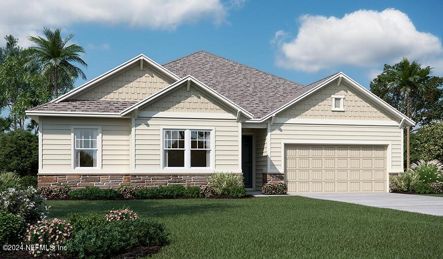 craftsman-style house with a garage and a front yard