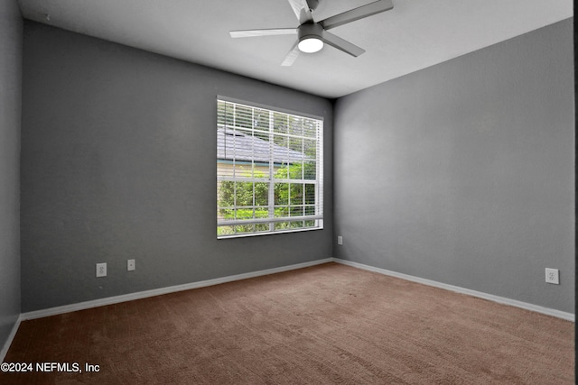 carpeted empty room with ceiling fan