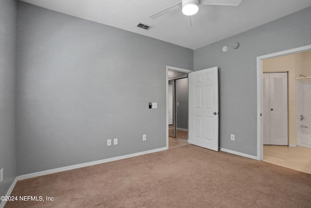 unfurnished bedroom featuring ceiling fan and light colored carpet