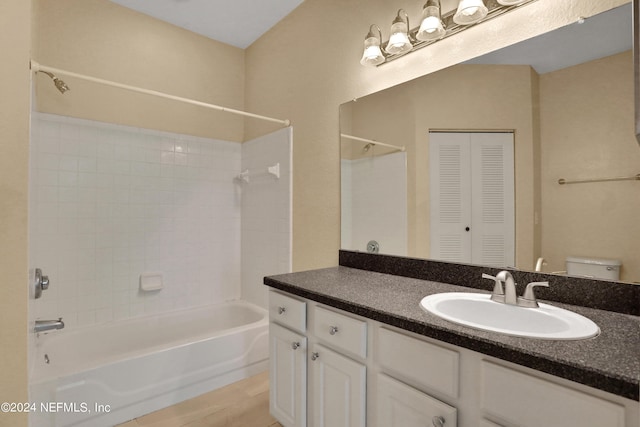 full bathroom featuring vanity, toilet, and tub / shower combination