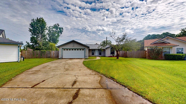 ranch-style home with a garage and a front yard