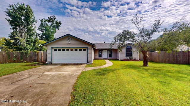 ranch-style house with a garage and a front lawn