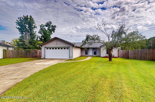 single story home with a garage and a front lawn