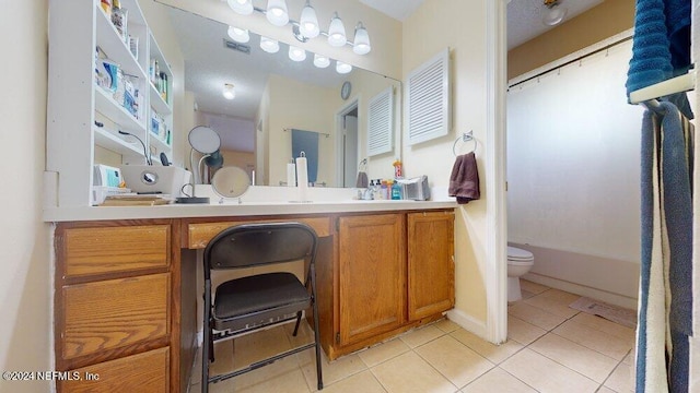 full bathroom with tile patterned flooring, vanity, shower / bath combo, and toilet