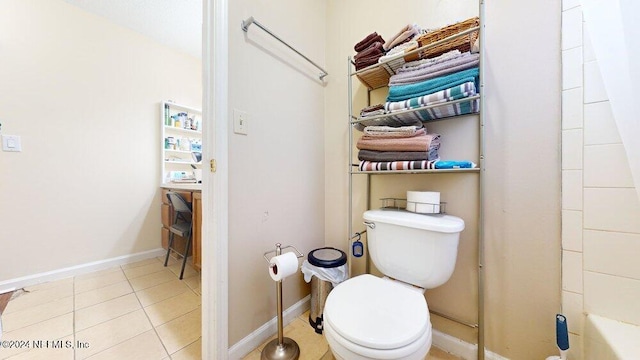 bathroom with walk in shower, tile patterned floors, and toilet