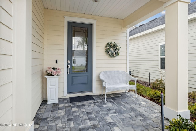 doorway to property with a patio area