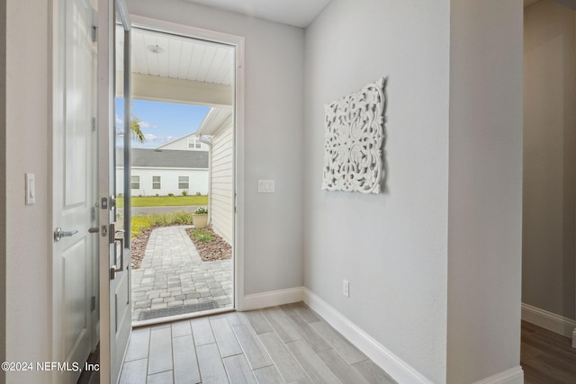 doorway with light hardwood / wood-style flooring