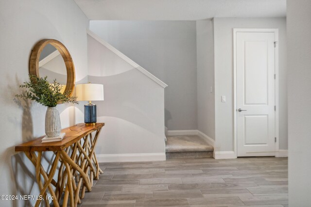 hallway with wood-type flooring