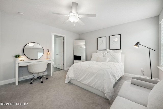 carpeted bedroom with ceiling fan