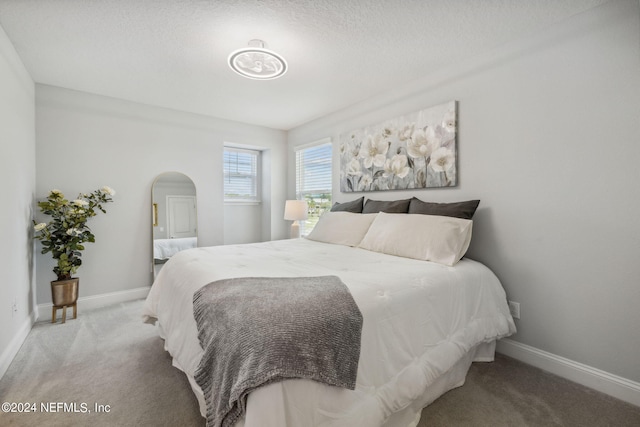 bedroom featuring light carpet