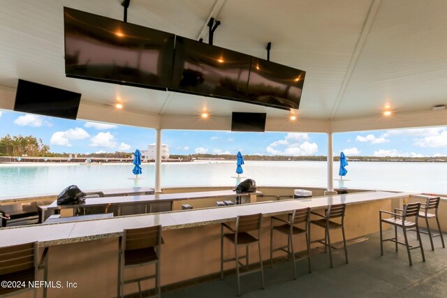 kitchen with a breakfast bar and pendant lighting