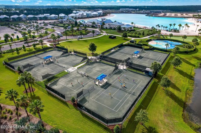 birds eye view of property with a water view