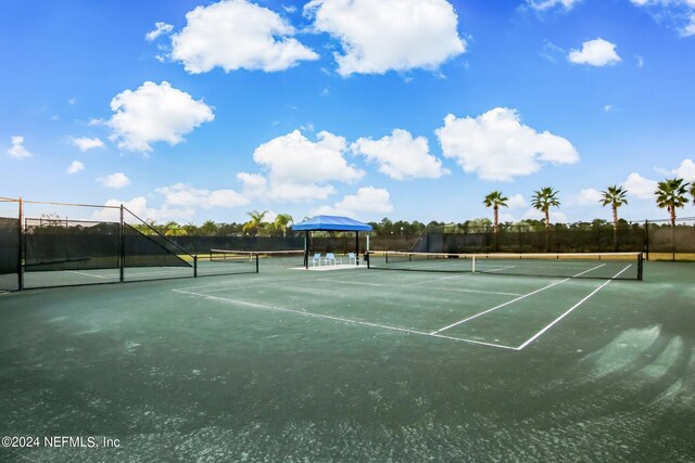 view of tennis court with a gazebo