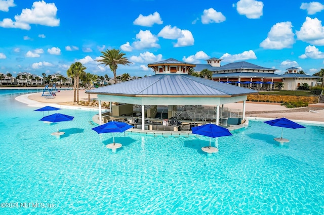 view of swimming pool featuring a gazebo