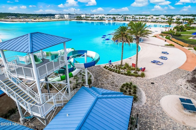 view of pool featuring a playground