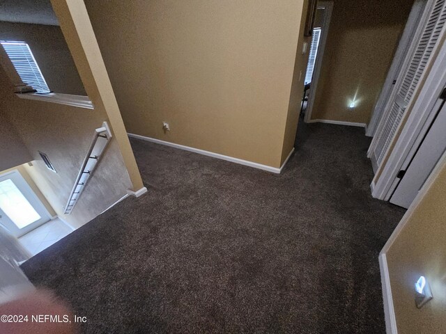 hall featuring carpet