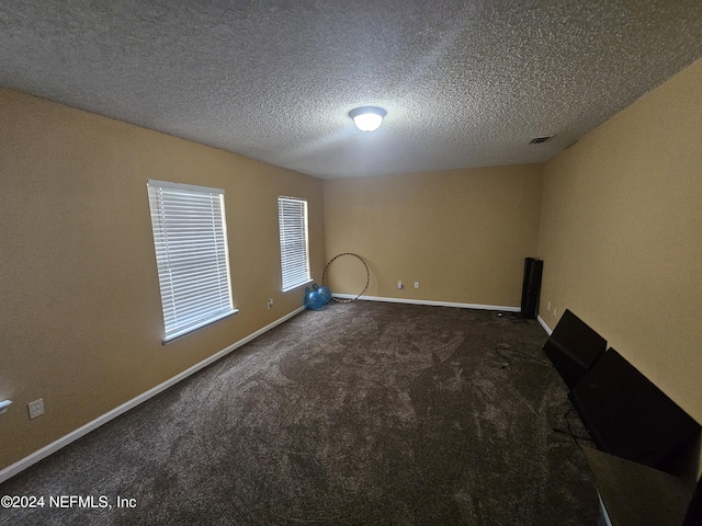 2727 Wood Stork Trl, Orange Park, FL 32073 - unfurnished room featuring carpet flooring, visible vents, a textured ceiling, and baseboards
