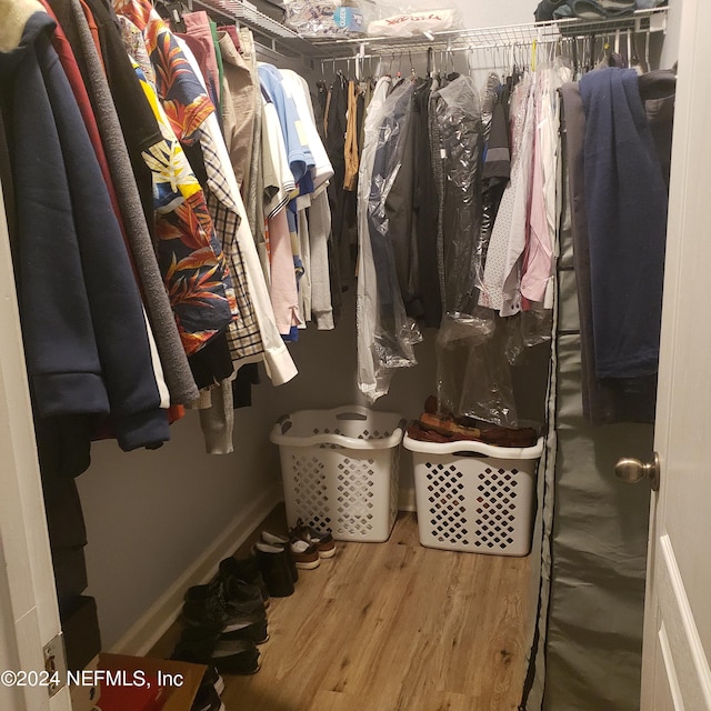 spacious closet featuring wood finished floors