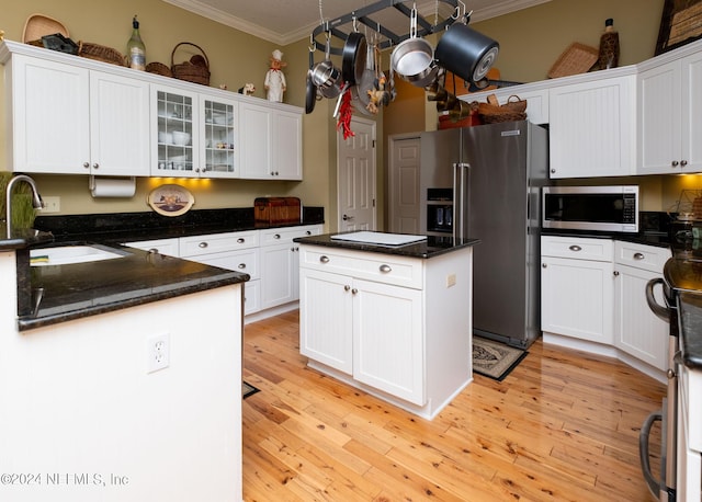 kitchen with white cabinetry, sink, and appliances with stainless steel finishes