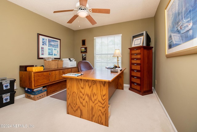 office space with light carpet and ceiling fan