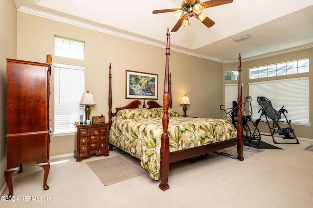 bedroom featuring ceiling fan, light colored carpet, and ornamental molding