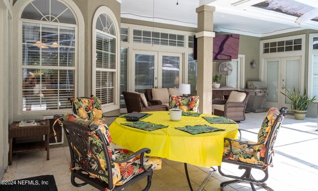 view of patio featuring grilling area, french doors, and an outdoor living space