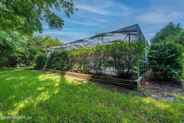 view of yard with a lanai