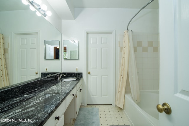 bathroom with tile patterned flooring, vanity, and shower / tub combo with curtain